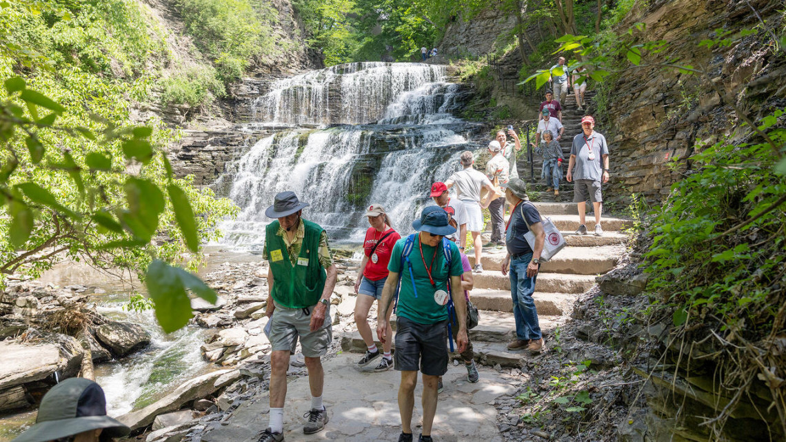 Attendees at Reunion 2026 tour Cascadilla Gorge, which winds through Cornell's Ithaca campus.