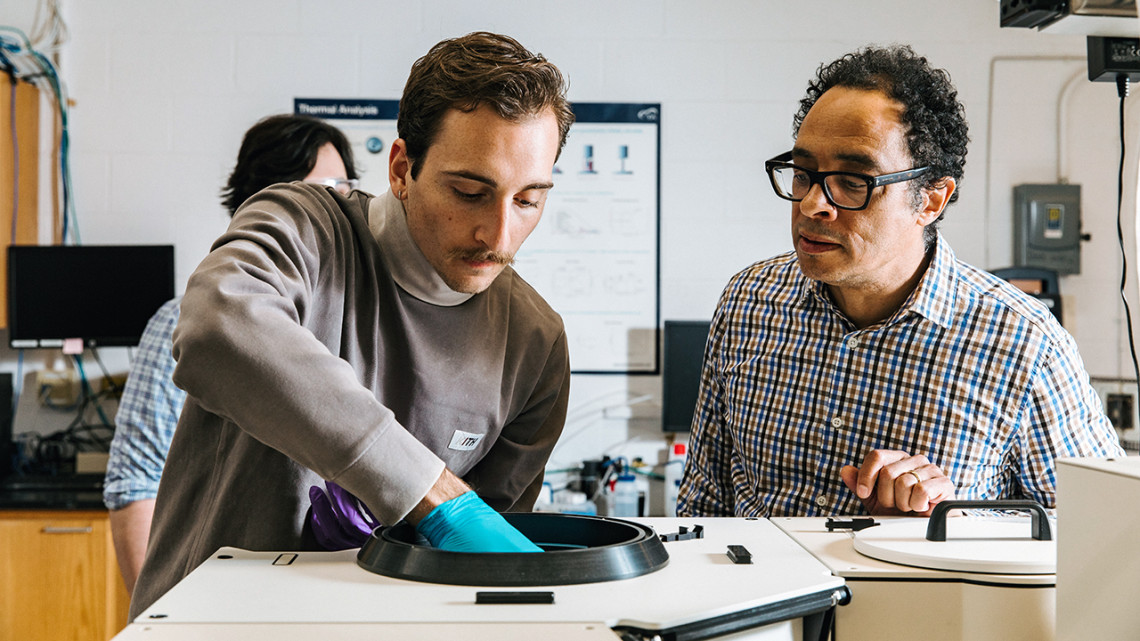 Doctoral student Thomas Ugras (left) and Richard Robinson, professor of materials science and engineering, research “magic-size clusters” in the Robinson Group Lab.