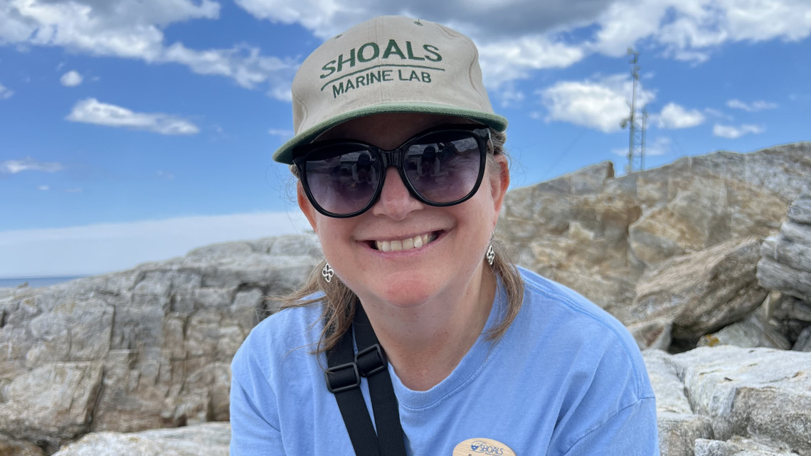 Women wearing a hat and sunglasses on a rocky island
