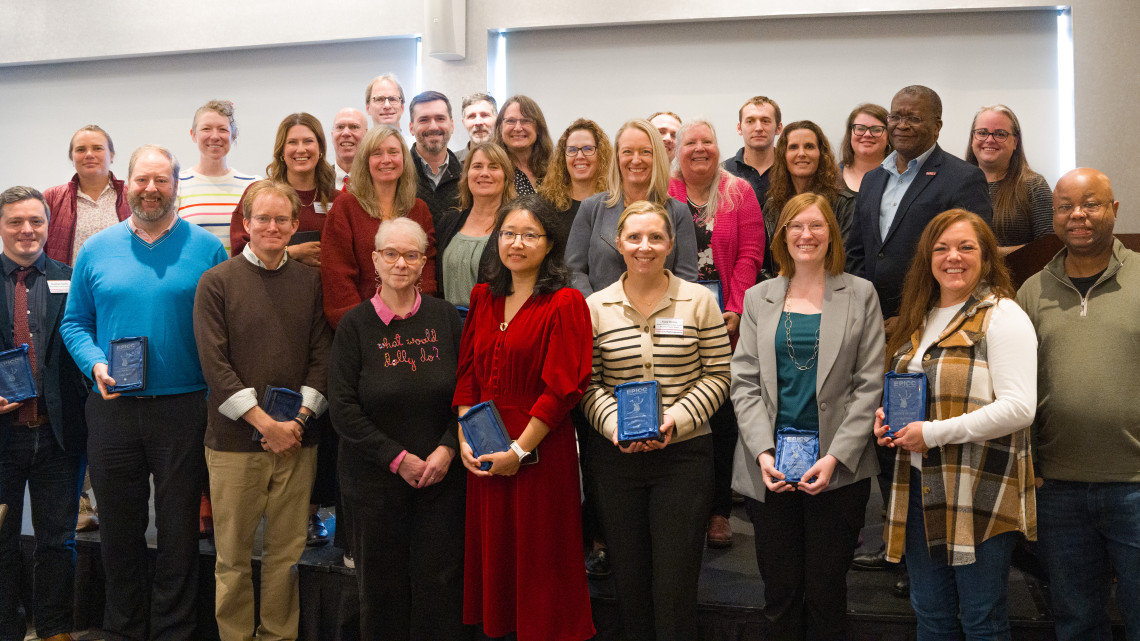 group of people hold awards