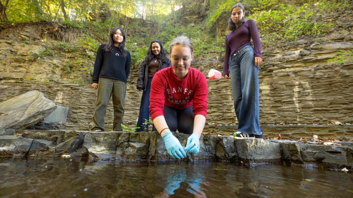 Students in the research group of Damian Helbling, professor in the Cornell Duffield College of Engineering, test for per- and polyfluoroalkyl substances (PFAS) in Cascadilla Gorge on Oct. 6.