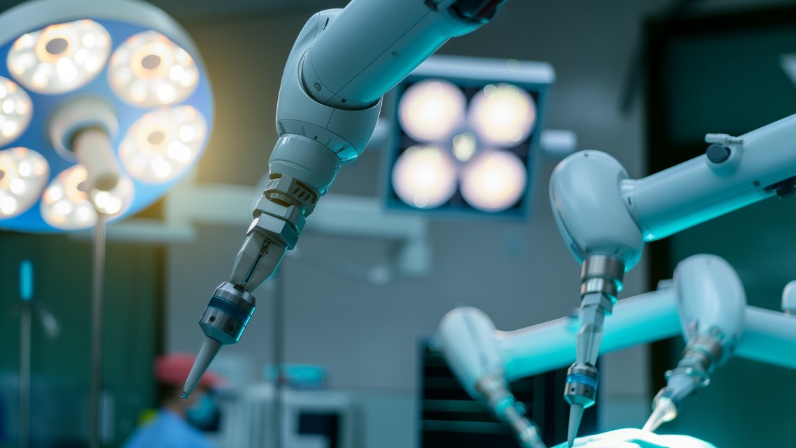 The arm of a robotic tool in a hospital surgical room.