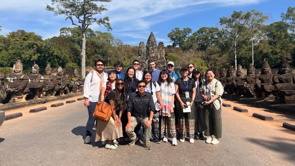 Cambodia winter program students with archaeology expert Ea Darith at the southern entrance to Angkor.