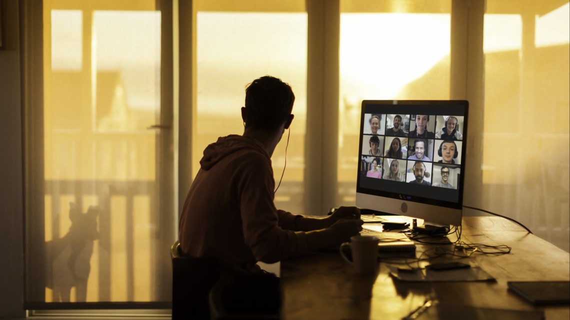 Worker distracted by dog while participating in a virtual meeting