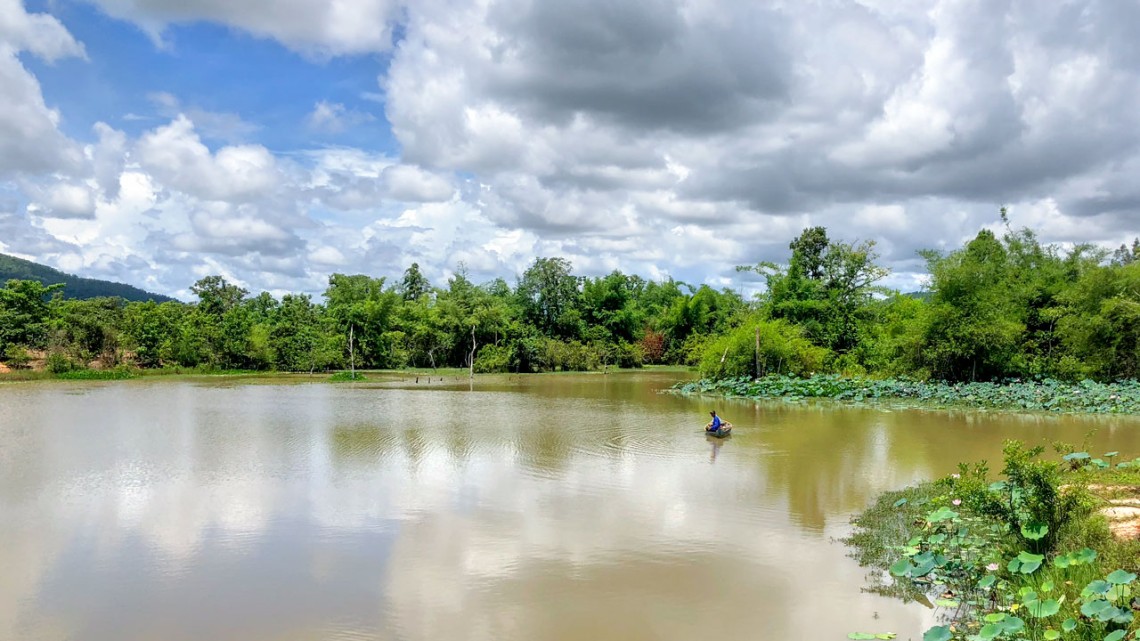 A boat floats in the Community Fish Refuge within the rice field fisheries of Cambodia