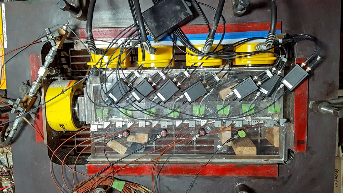 Top view of a tabletop apparatus used to generate sequences of laboratory earthquakes.