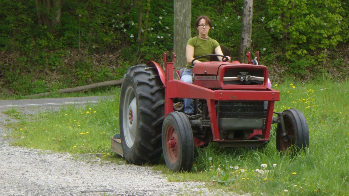 Nina Saeli driving a tractor