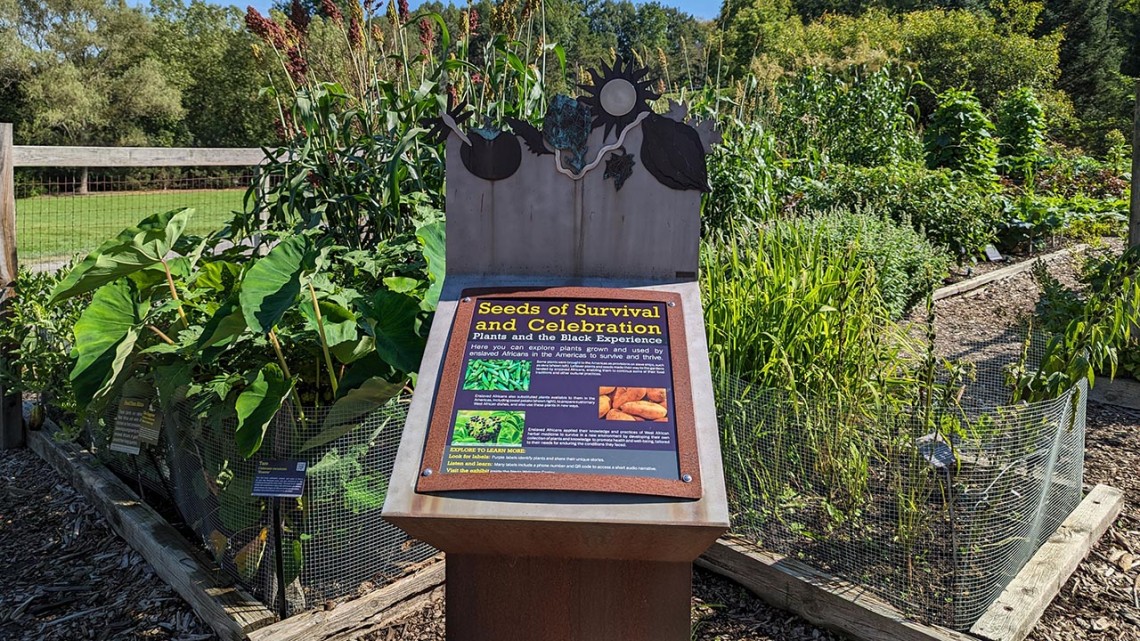 Image of interpretive sign and garden