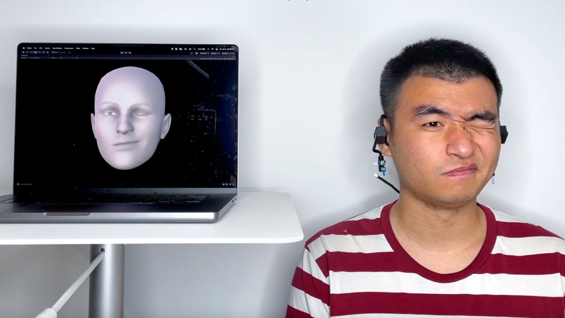 Avatar on computer screen copies man winking