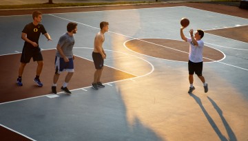 group plays basketball