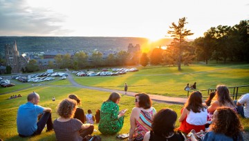 Reunion attendees watching the sunset from Libe Slope. 