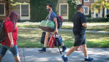 Students cross paths during move in