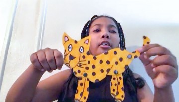 Girl holding cutout cheetah