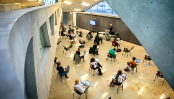 Students meet for class in Milstein Hall.