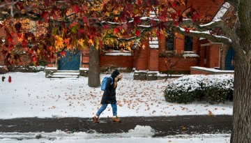 Fall colors hang on as an early snow lands on campus.
