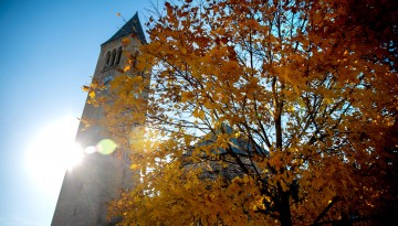 The sun shines over McGraw Tower.