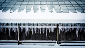 Icicles hang from the roof of a greenhouse along Tower Road.