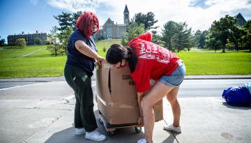 Students return to West Campus, with the helping hands of Cornell's volunteers.