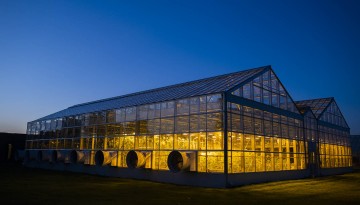 Guterman Bioclimatic Laboratry greenhouse at dusk.