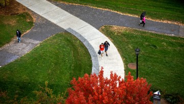 Students cross the pathways at the top of Libe Slope.