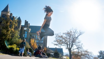 A member of Cornell Quad Squad practices at Libe Slope.