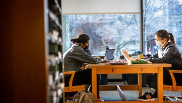 Students study for finals in Uris Library.