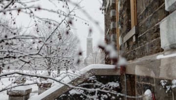 McGraw Tower shown through the Arts Quad on the first snowfall of January.