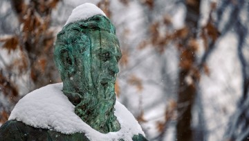 The statue of Ezra Cornell on the Arts Quad is seen covered in snow following a winter storm.