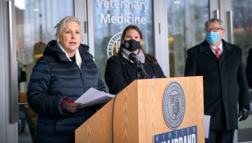 U.S. Sen. Kirsten Gillibrand (D-New York) visited the College of Veterinary Medicine on Jan. 7 to discuss proposed legislation focused on pandemic response and prevention. At right are Shawna Black, chair of the Tompkins County Legislature, who introduced Gillibrand, and Dr. Lorin Warnick, the Austin O. Hooey Dean of the College of Veterinary Medicine.