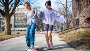 Friends learn to skate on the Arts Quad.