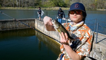 A student shows off his catch on Beebe Lake.