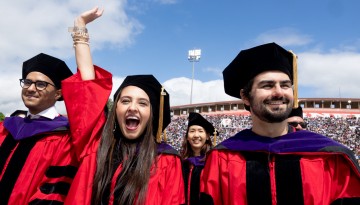 PhD Graduates expressing joy.