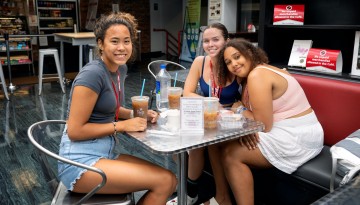 Cornell summer students enjoy a lunch break in the cafe at the Cornell Store on Ho Plaza. 