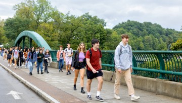 Students coming from North Campus cross Thurston Bridge on the first cay of classes.