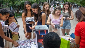 Students enjoy the CU Downtown event on the Ithaca Commons.