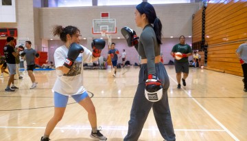 Students participating in an Intro to Boxing class in Bartels Hall.