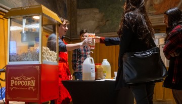 Campus Activities hands out popcorn in Willard Straight Hall.