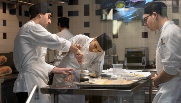 Hotelies work together in the teaching kitchens of Statler Hall.