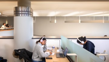 Students work in the Cocktail Lounge of Uris Library.