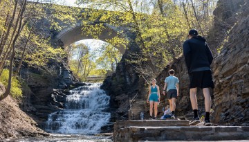 Visitors enjoy the Cascadilla Creek gorge trail on a warm spring morning.