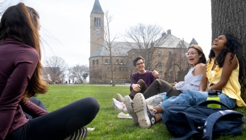 Students enjoy a warm spring day on the Arts Quad.