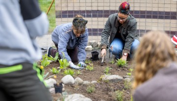 Students from Cornell Botanic Gardens’ Learning by Leading program and the American Indian and Indigenous Studies program plant the “Full Circle Healing and Honoring Garden” in front of Akwe:kon.