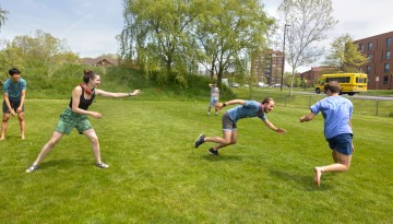 Members of the Cornell Outing Club play games on Jessup Field.