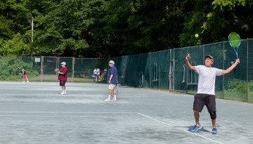 Tennis players enjoy a game at the Cornell Faculty Tennis Club.