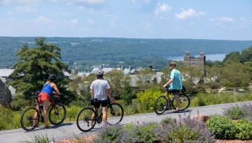 Bikers enjoy the vista from Libe Slope on a warm summer day.