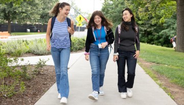 Students head to class near the Martin Y. Tang Welcome Center.