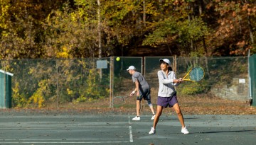 Cornell Faculty Tennis Club members play during an autumn morning.