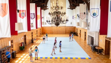 Seniors roller skate in the memorial room of Willard Straight Hall during Senior Days.