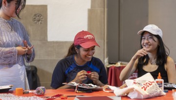 Students decorate their graduation caps during a Senior Days activity at Willard Straight Hall.