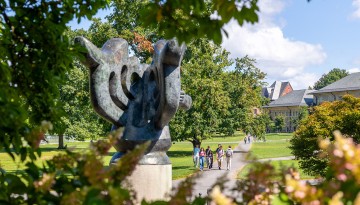 Students walk to class through the Arts Quad.